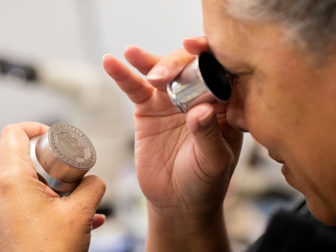 Checking the obverse design for the coin